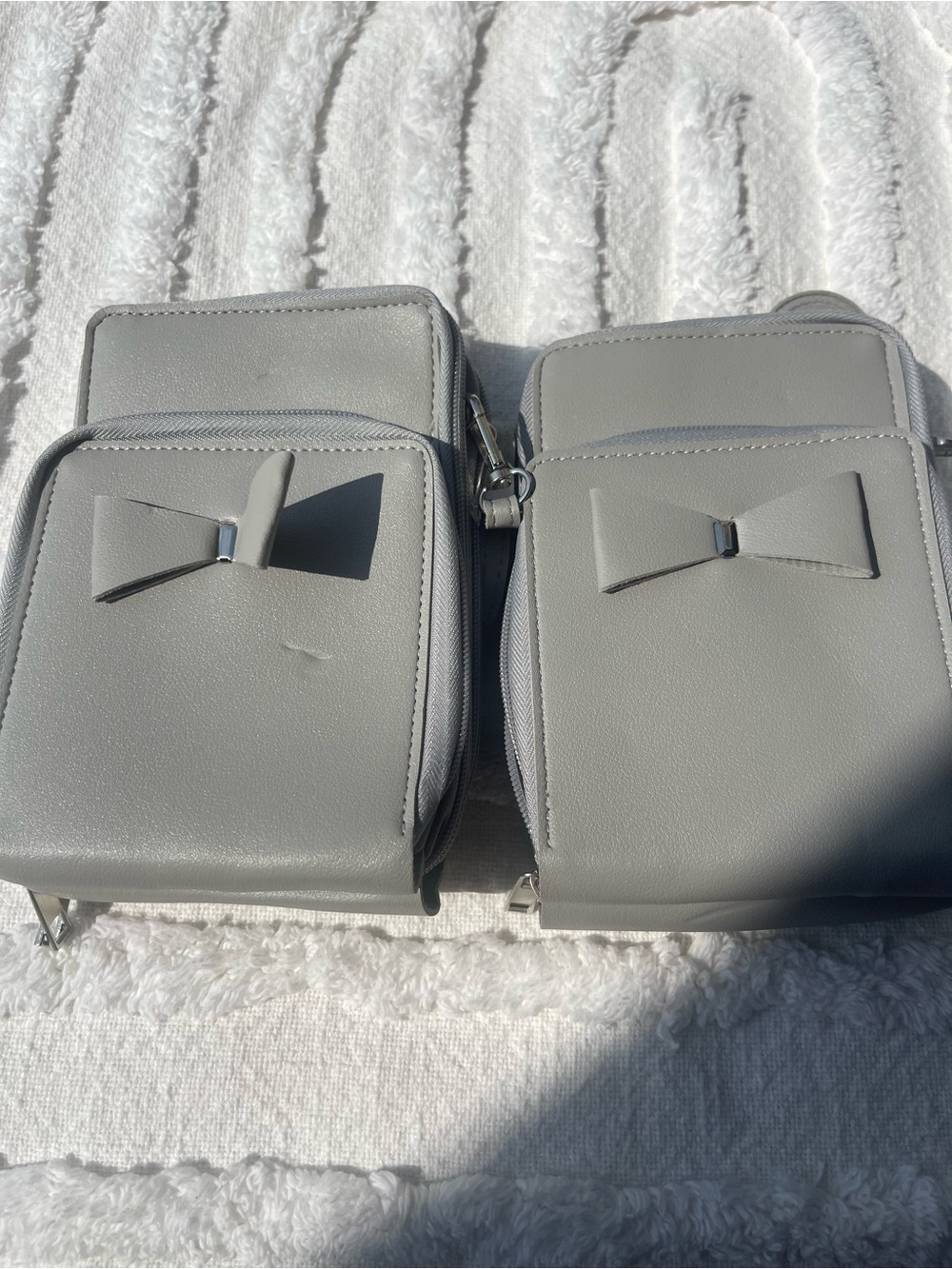 Grey crossover bag with 3 zippered compartments